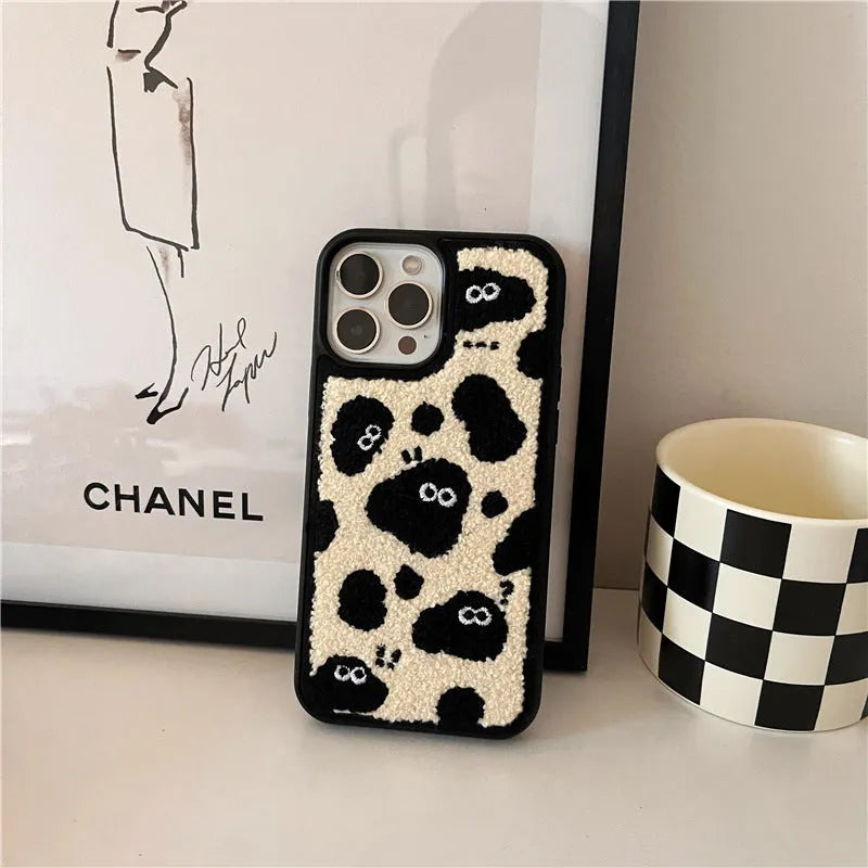 Black plush soft back phone case featuring a fairy character design for compatible iPhone models.