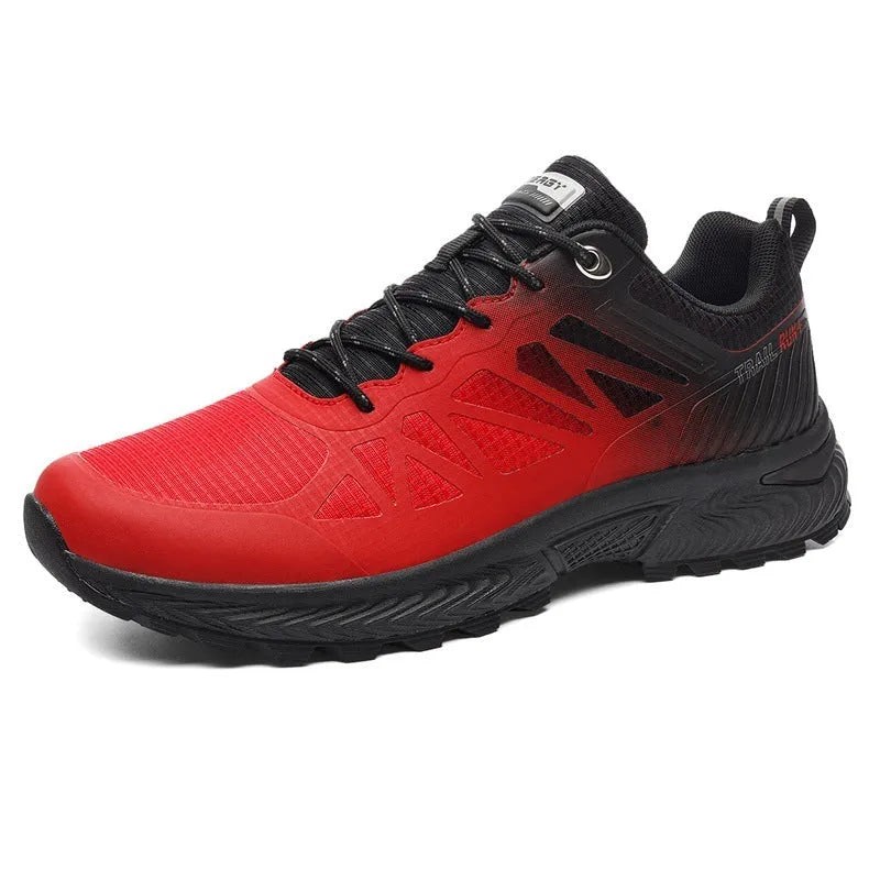 Men's black and orange mesh running shoe with lace-up front and rubber sole.