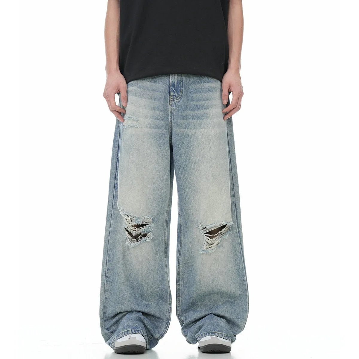 Men's blue straight-leg jeans with ripped detailing on the legs and a zipper fly closure.