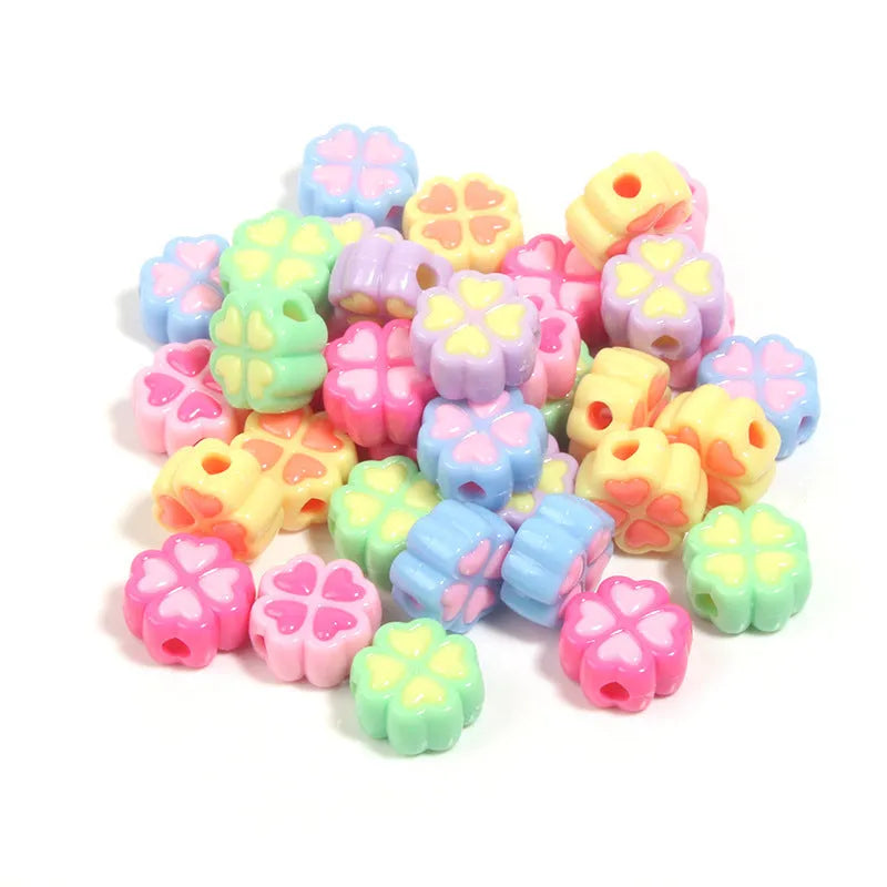 Acrylic four-leaf clover beads with frosted finish in mixed cartoon colours