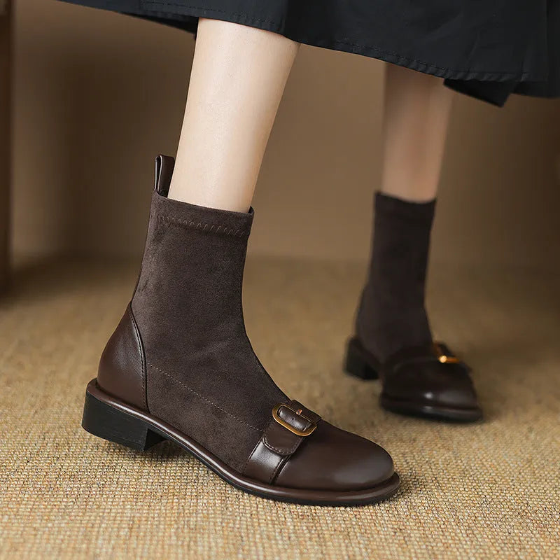 Black women's low heel Martin ankle boots with front lace-up and metal buckle detail on a white background.