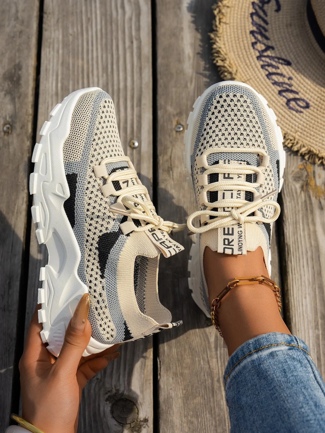 Women's Flyknit lace-up sneakers in a selected colour with a low rubber sole and round toe