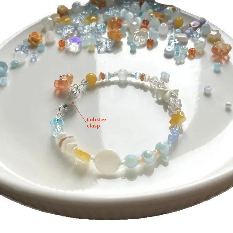 Orange mixed-alloy bracelet with diamond pattern and water-soaked bead seaside design