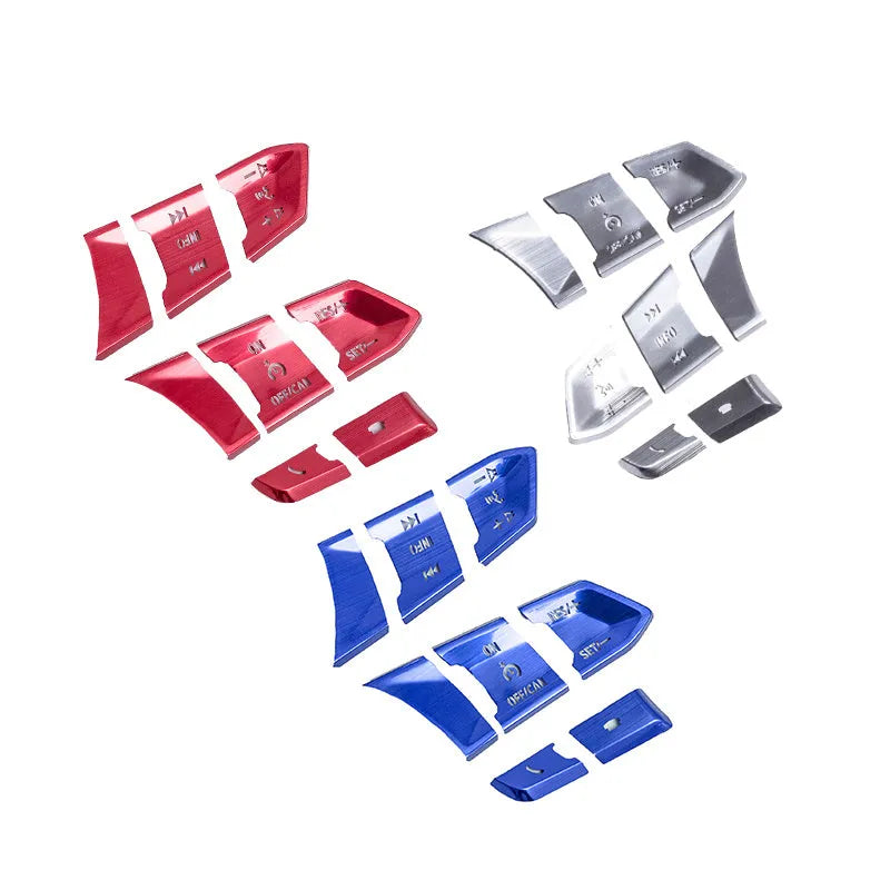 Atz modified vehicle steering wheel decorative sticker set showing aluminum alloy hollow button styles in brushed red, silver, and blue finishes