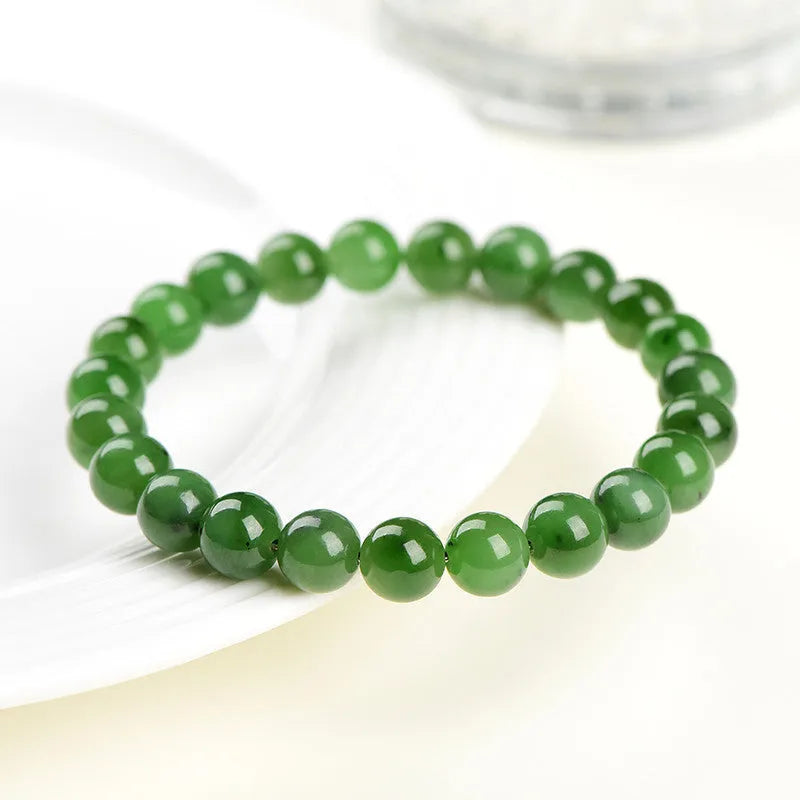 Natural jasper bead bracelet with polished spherical beads on a string, available in multiple sizes.