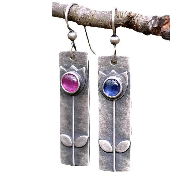 Antique finish red sapphire earrings with geometric ellipse shapes and electroplated metal construction