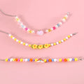 Colourful plastic pearl pet necklace with small flower, rainbow, or peach bead designs for cats