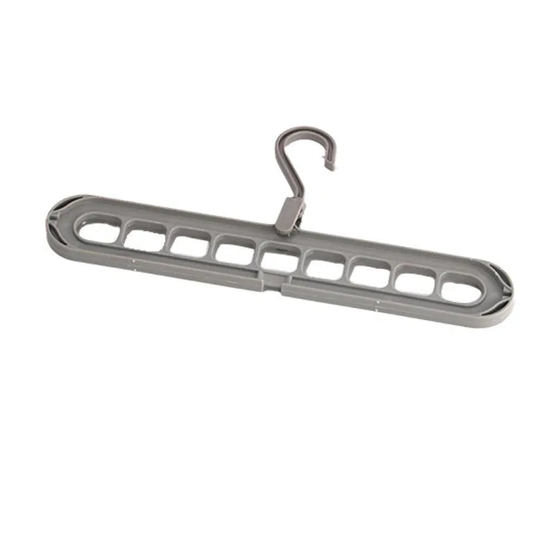 Green plastic nine-hole folding hanger for trousers displayed open and closed.