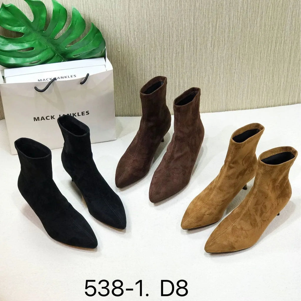 Women's black pointed toe ankle boots with stiletto heel and mid-calf height