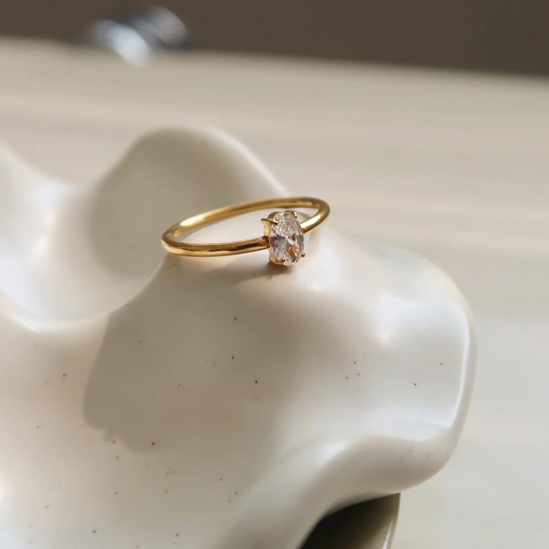 Golden electroplated stainless steel love heart ring showing heart shape design elements
