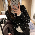 Women's grey dot knit viscose cardigan with crocheted flower details and long sleeves