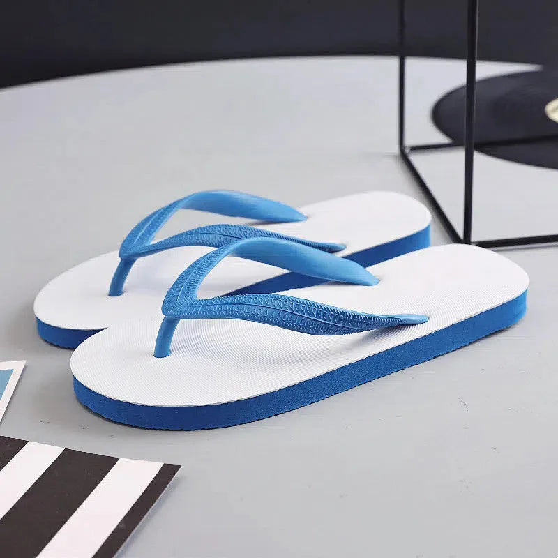 Rubber beach flip-flops with fish label design in green, red, blue, and black colour options
