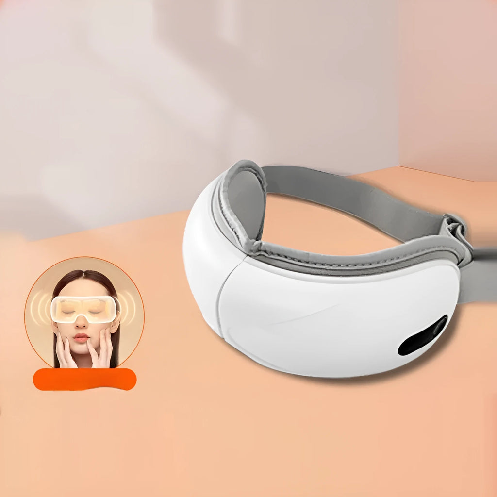 White rechargeable eye massager with airbag massage and hot compress functions showing compact design