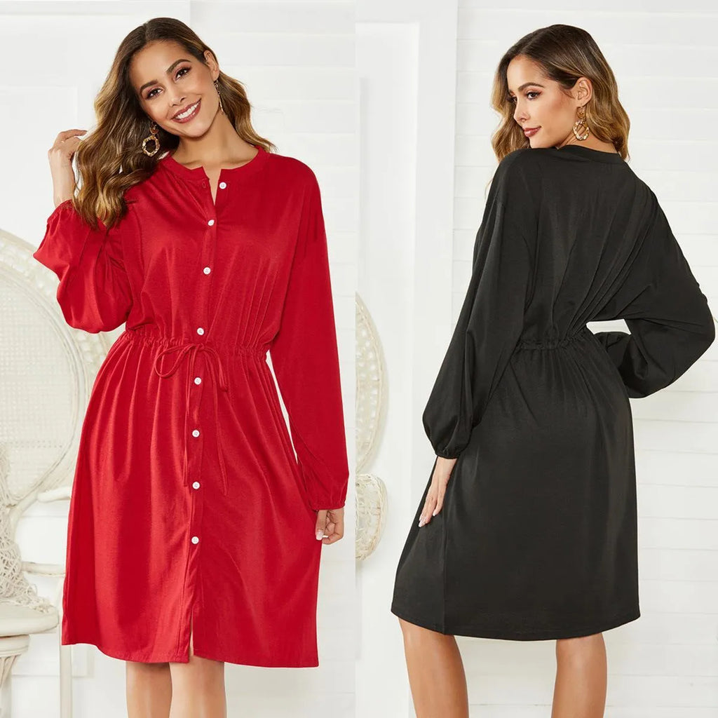Black A-line midi dress with cinched belt and long sleeves on a mannequin