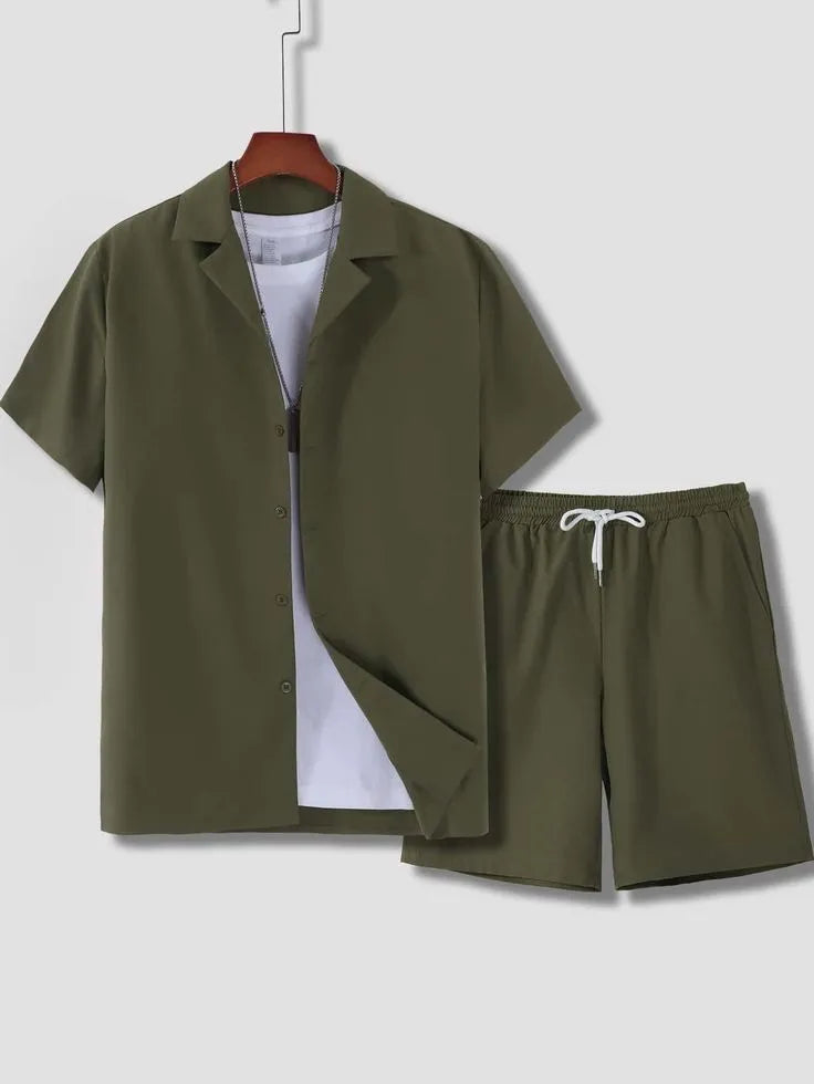 Man wearing a white short sleeve Cuban collar sport jacket with matching shorts.