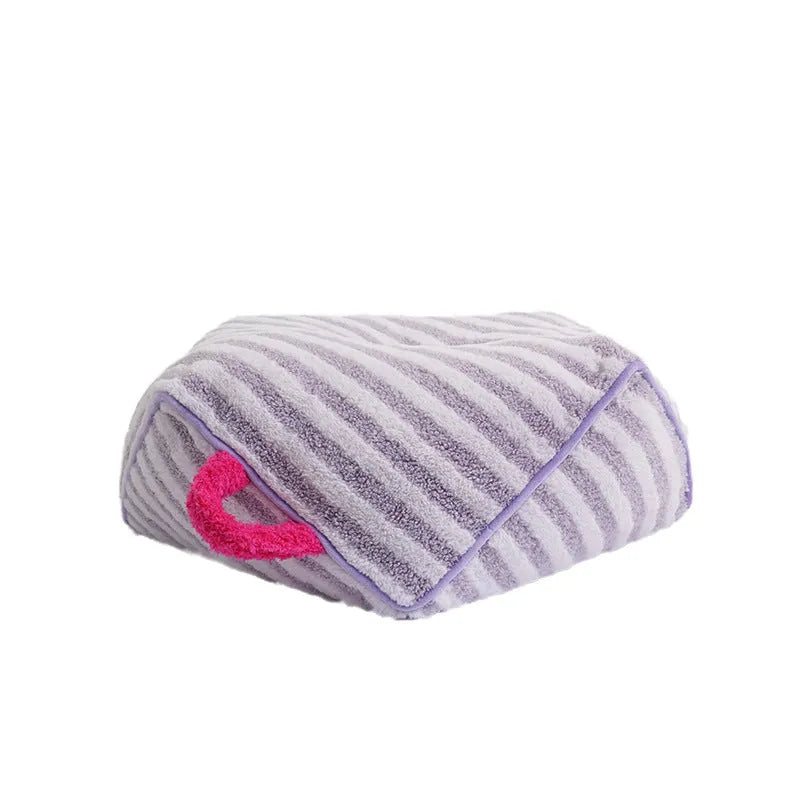 Striped soft velvet dog bed with removable cover in yellow, orange, and purple colour options.