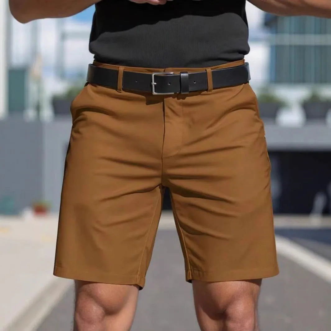 Man wearing straight-leg micro-elastic polyester fifth pants shorts in a choice of nine colours.