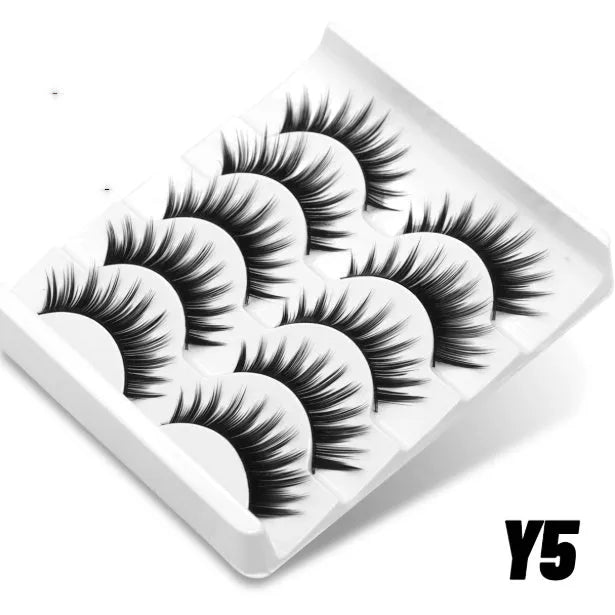 Box of artificial fibre false eyelashes with six style options and included adhesive tube