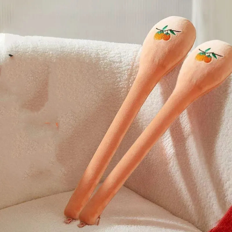 48 cm long persimmon coloured percussion massage stick with meridian flap design in a zipper case.