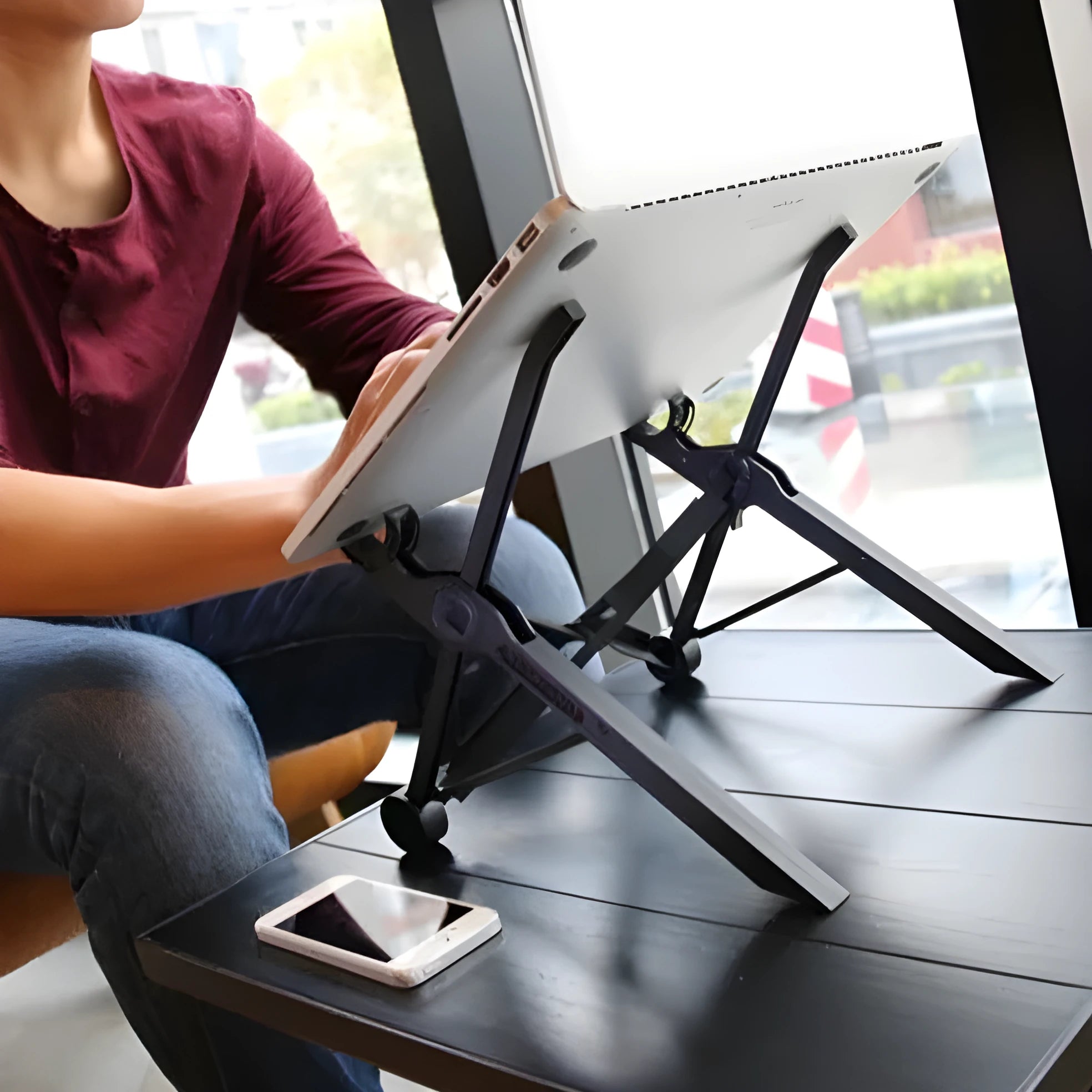Portable folding laptop bracket in sagacious black showing compact folded dimensions