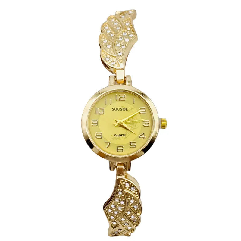 Stainless steel women's watch with round dial on wrist, showing gold surface finish option.