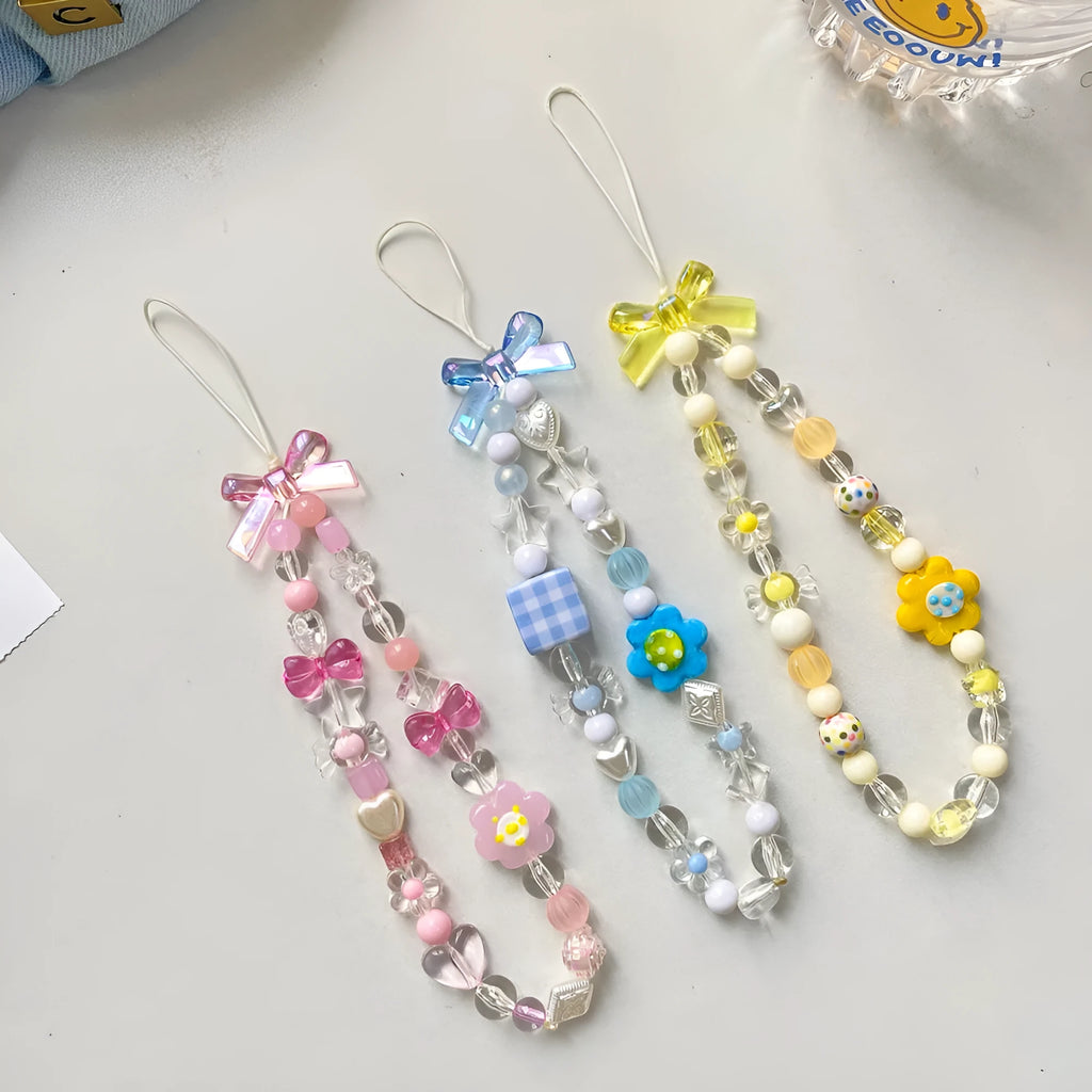 Beaded flower mobile phone lanyard with floral designs in yellow, blue, and pink colour options