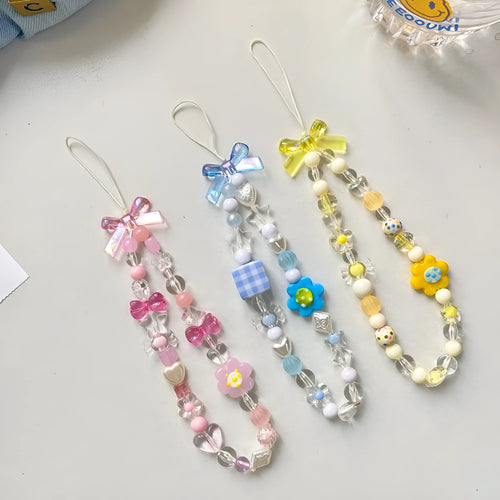 Beaded flower mobile phone lanyard with floral designs in yellow, blue, and pink colour options
