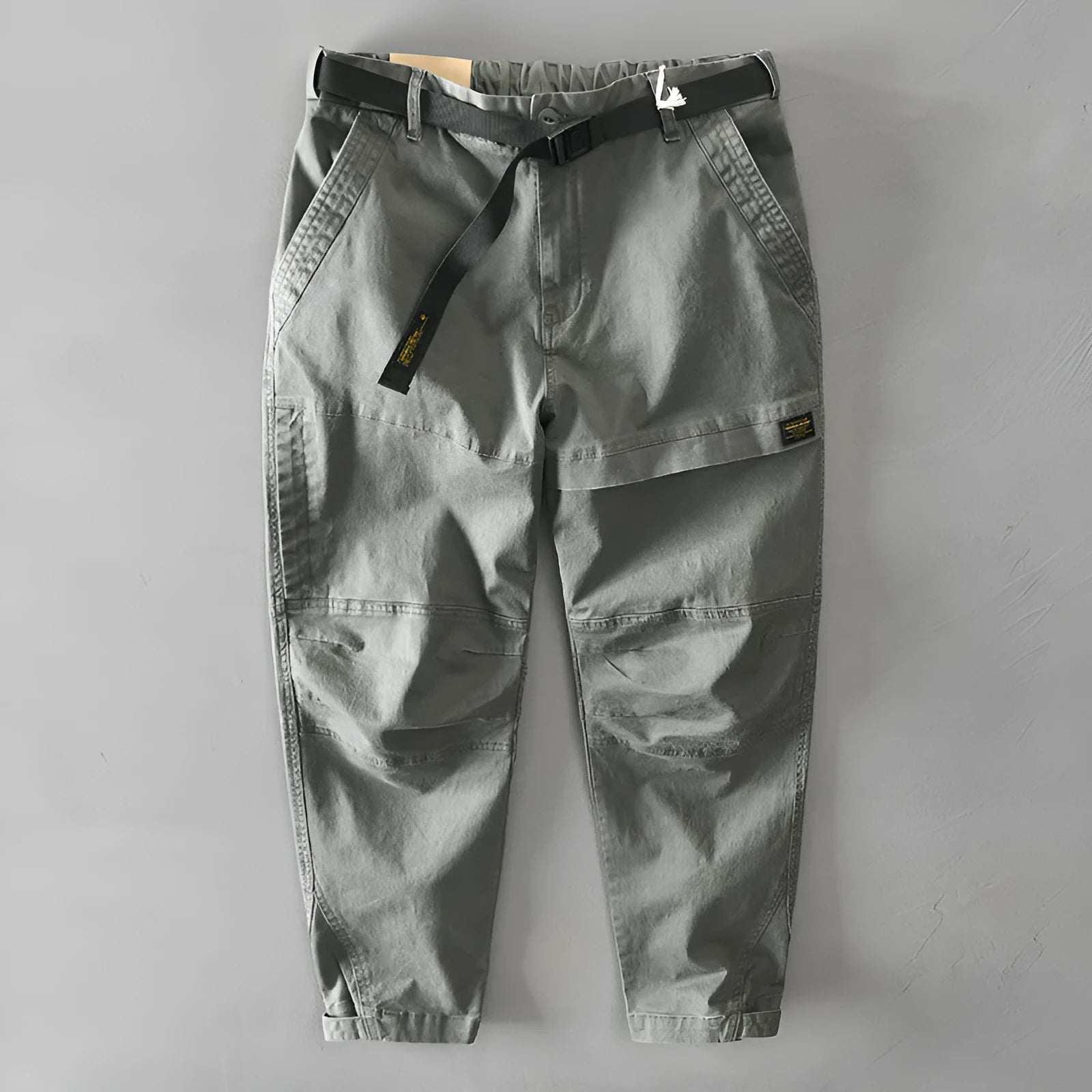 Men's loose-fit cotton overalls in army green colour, showing casual Japanese style and mid-waist design.