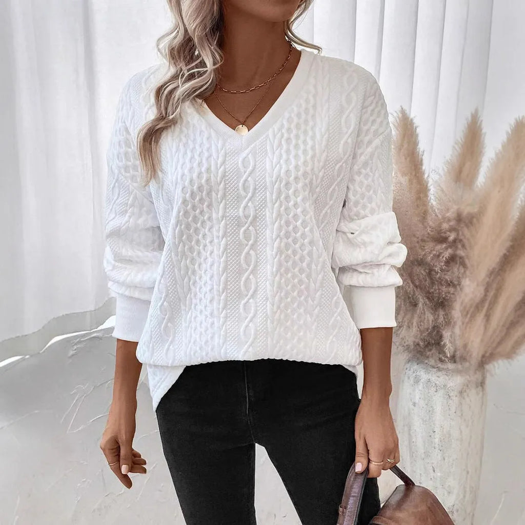 Milky white loose fit long sleeve t-shirt with a 3D pattern on a hanger