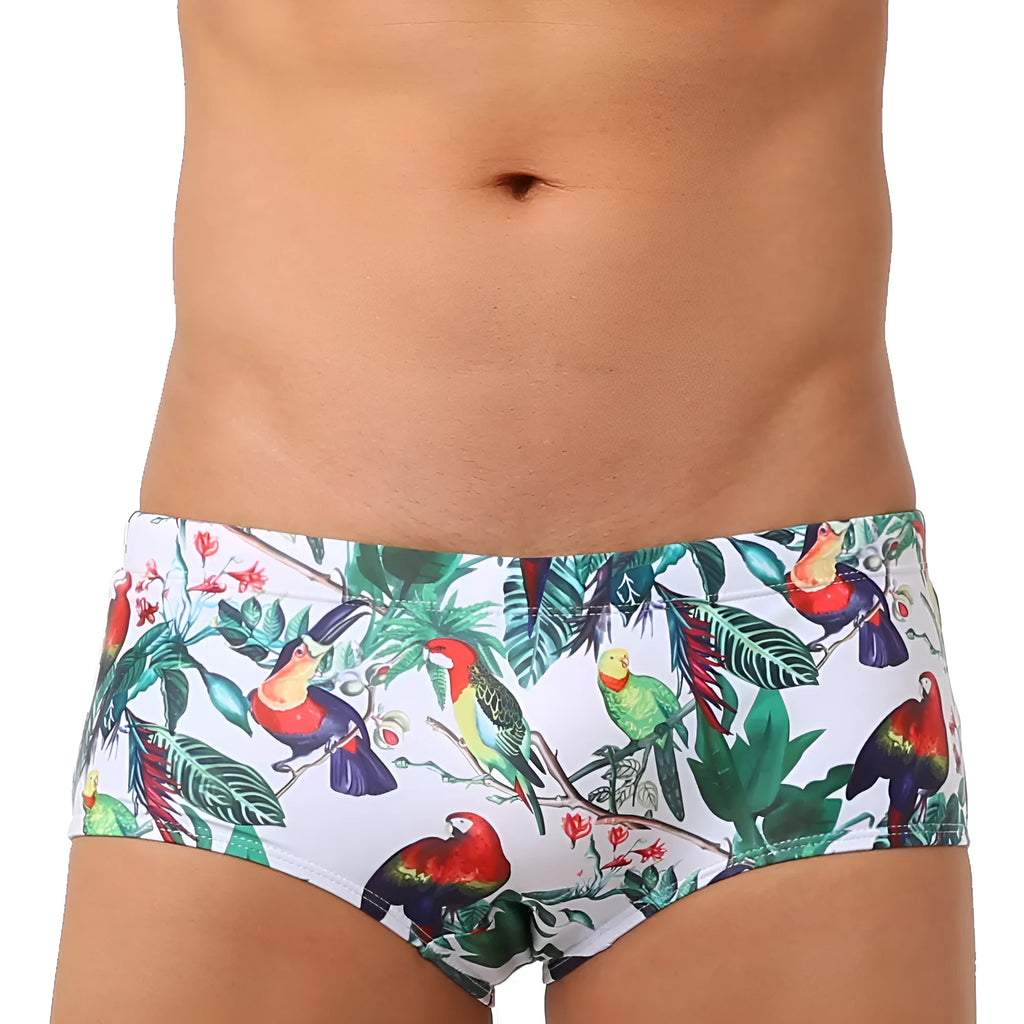 Men's floral and bird print nylon swimming trunks in boxer brief style with cup cover.