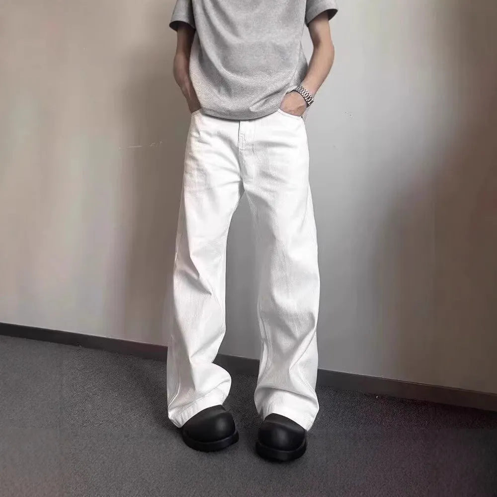 Men's white straight leg jeans with mid-waist zipper fly and loose wide leg cotton denim design