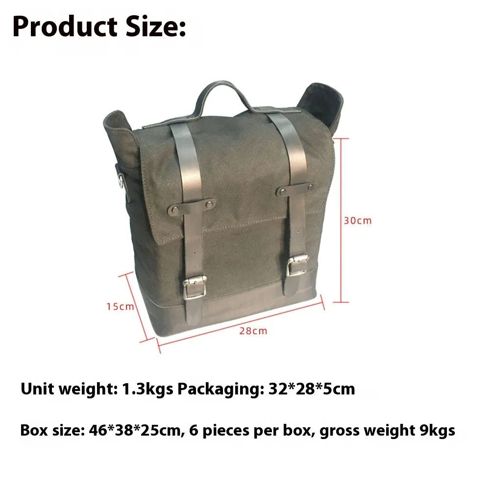 Black waterproof canvas motorcycle side pannier bag with leather trim mounted on a bike