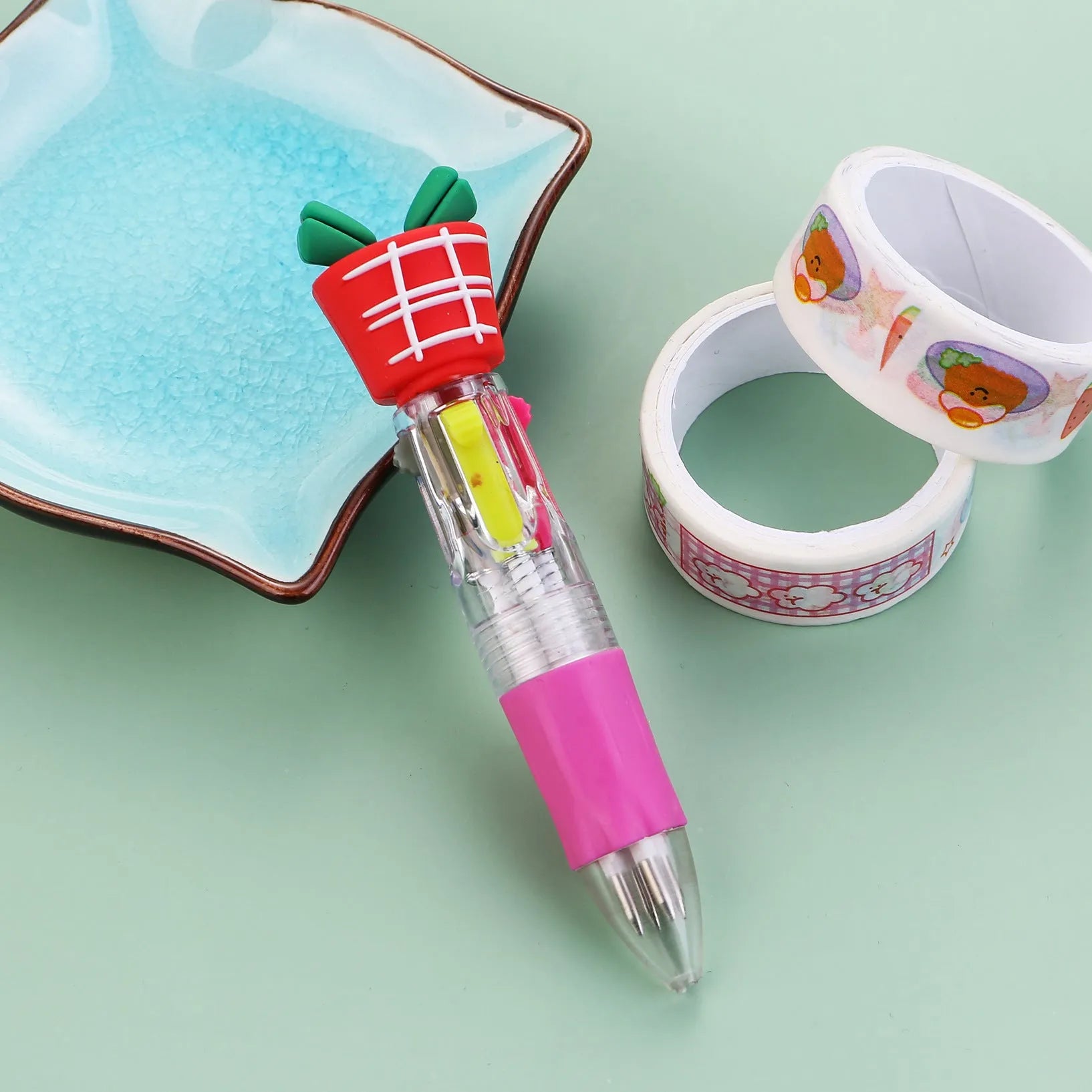 Compact 11cm Christmas four-colour press pen with festive designs including reindeer and snowmen.