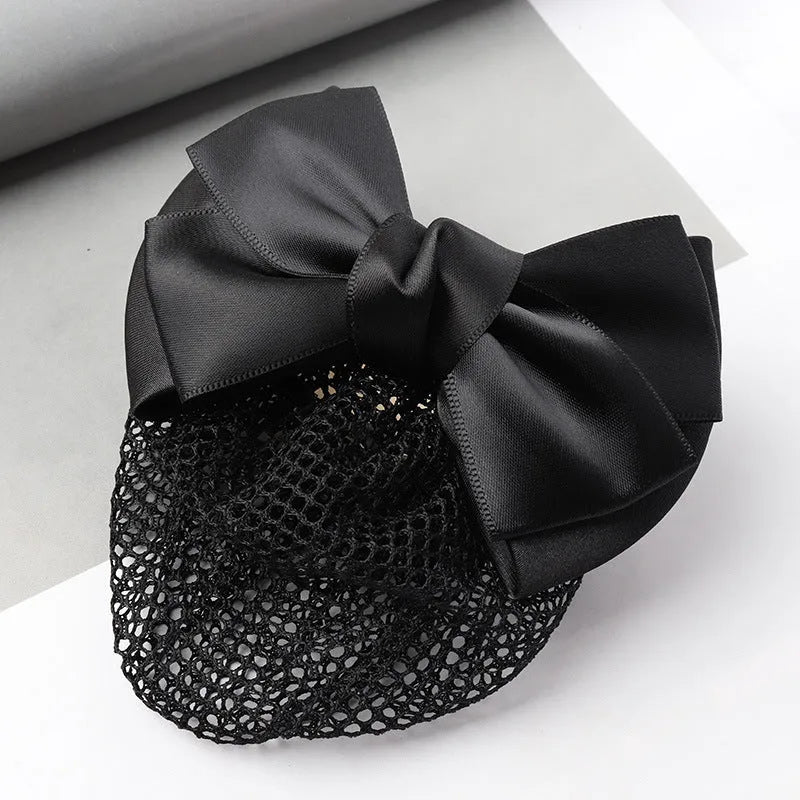 Professional flower bow headdress hair clip ornament on a work plate, shown in a selection of net and mesh colour variations.