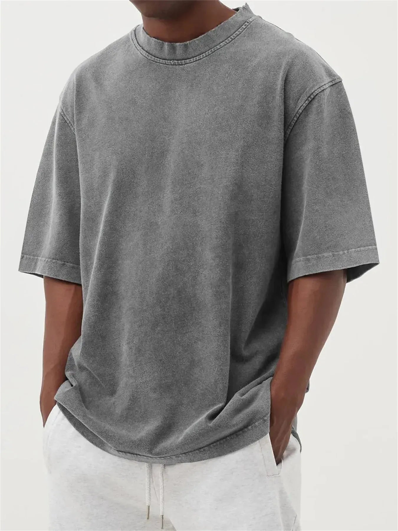 Men's loose fit distressed pullover t-shirt in stone washed polyester showing half sleeve design