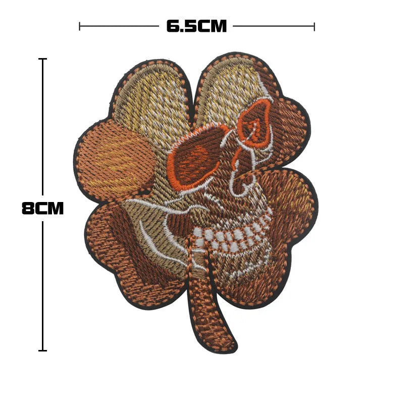 Outdoor embroidered fabric badge with Velcro backing on a tactical vest.