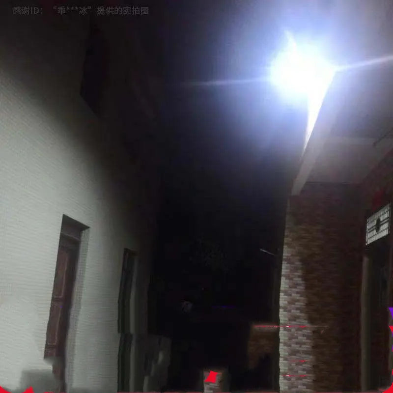 Black solar-powered outdoor LED garden floodlight with remote control on a wall.