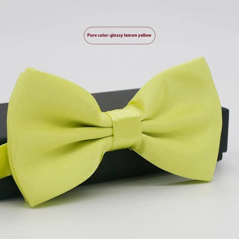 Men's flat head solid colour bow tie in polyester, showing 12cm by 6cm size on a background.