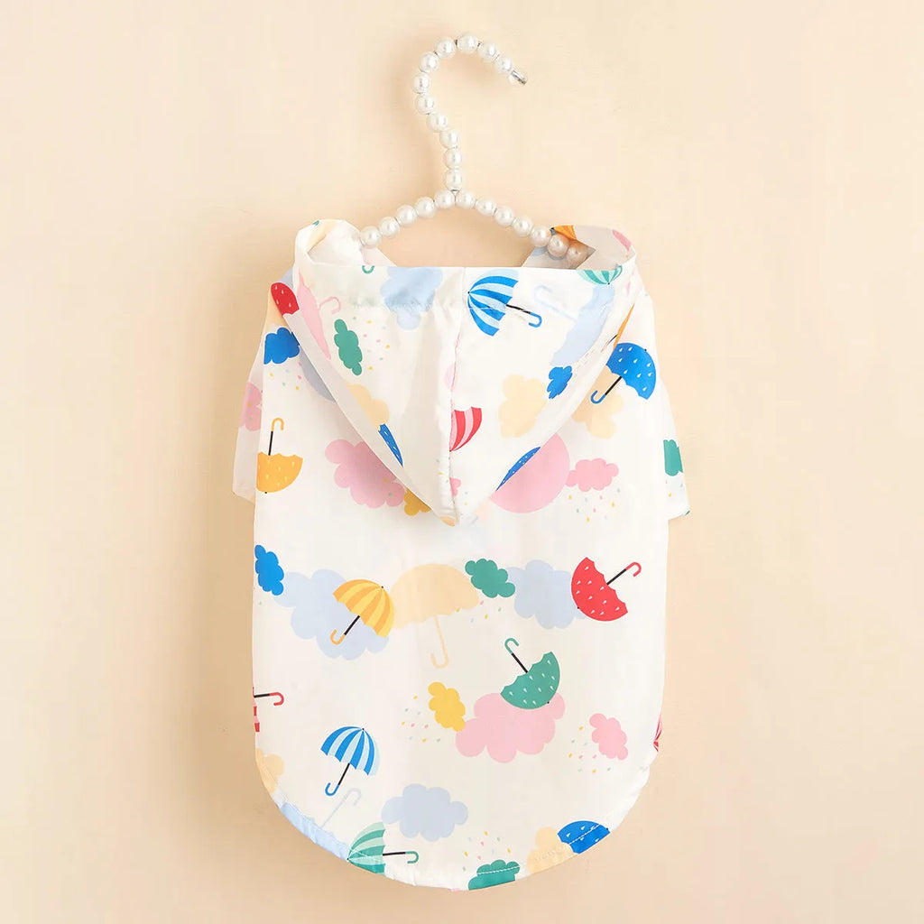 Colourful cartoon umbrella pattern polyester raincoat for a small dog, featuring a hood.