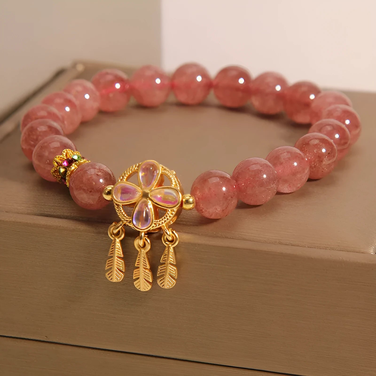 Women's strawberry quartz crystal bracelet with four-leaf clover dream catcher pendant