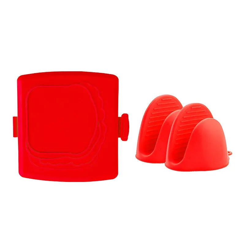Red silicone baking tray with heat-resistant gloves on kitchen counter