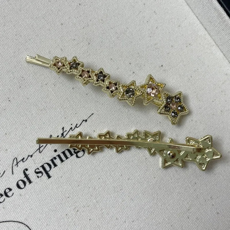 Gold alloy hair barrette with rhinestones and a star charm, shown as a side clip for bangs.