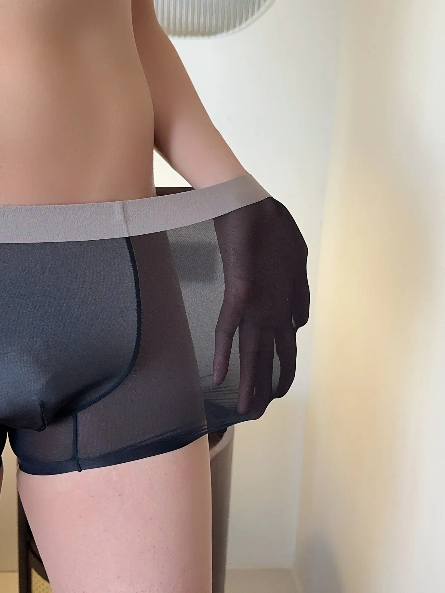 Seamless men's boxer shorts in ultra-thin honeycomb fabric, shown in a nude colour.