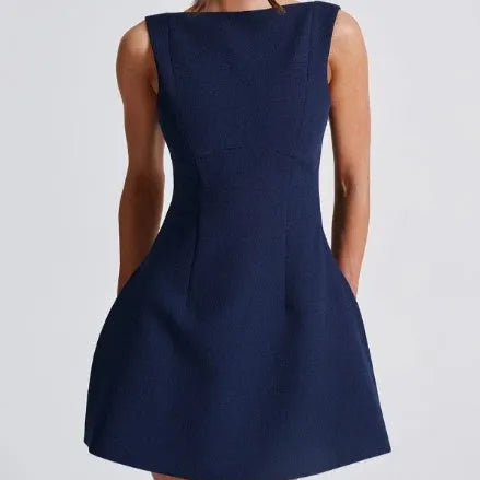 Slim-fitting backless sleeveless short dress in a sling style on a hanger.
