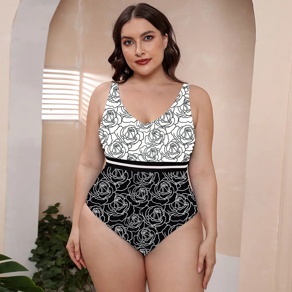 Blue and white printed one-piece swimsuit for women with spaghetti straps, shown on a mannequin.