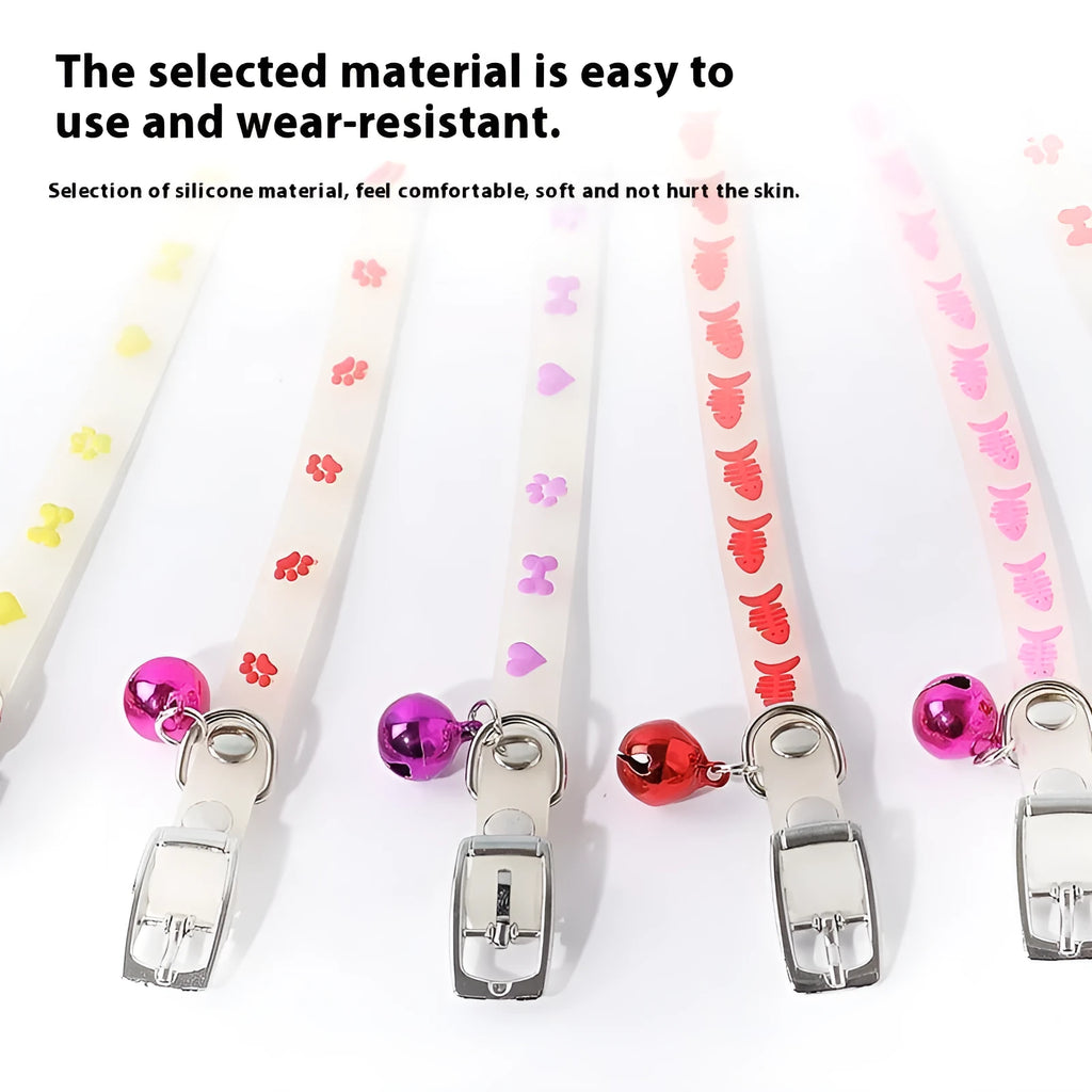 Luminous cat collar with adjustable silicone strap and metal bell in paw print pattern