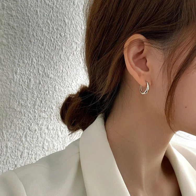 Geometric water drop earrings in gold or silver on a white background, showing small, medium, and large sizes.