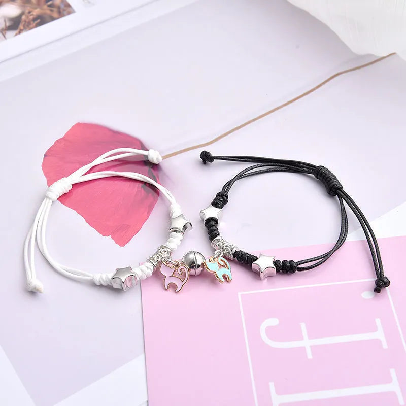 Pair of alloy suction bracelets with engraved symbol choices including crown, love lock, and clover.
