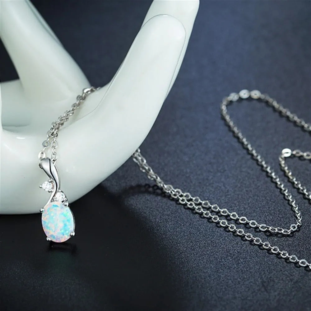 Water drop shaped opal pendant necklace on adjustable O chain in rose gold or white
