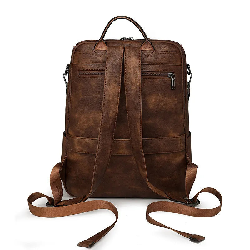 Retro college backpack with curved shoulder straps in multiple colour options including black, blue, grey, and coffee tones